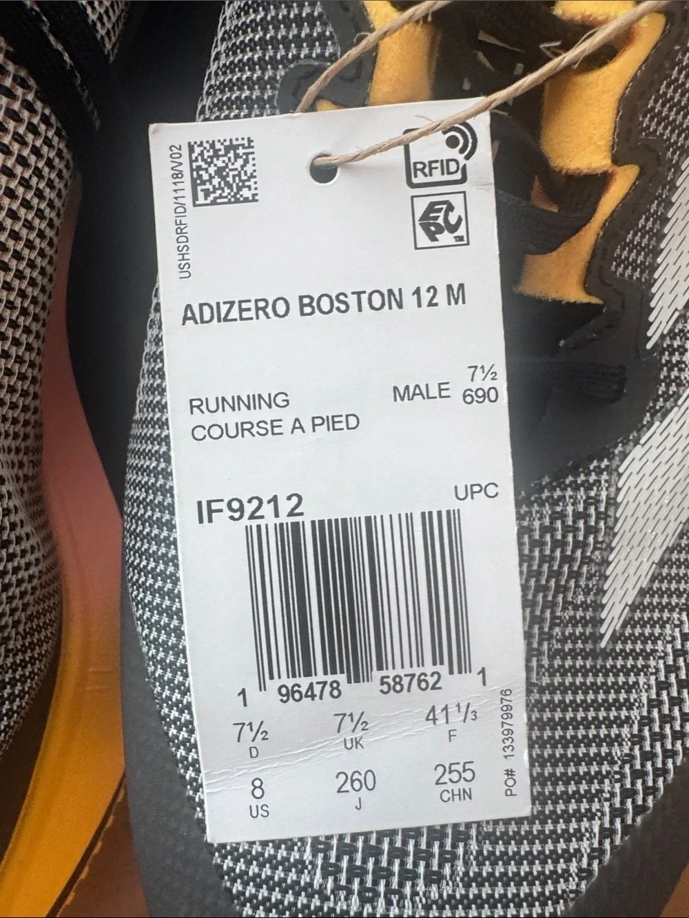 Adidas Adizero Boston 12 running shoe in the Core Black/Zero Metallic/Spark